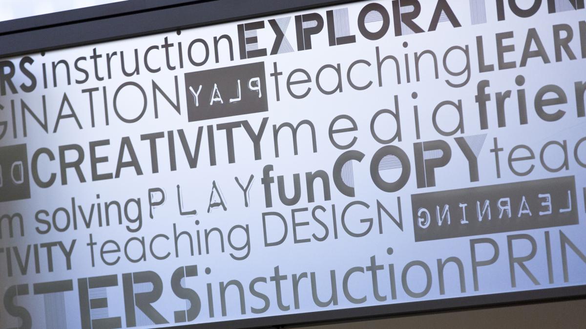 Black-and-white collage of words, each formatted using different fonts. Words include: creativity, learning, teaching, play, solving, design, and media.