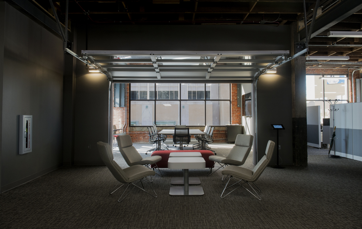 Chairs and tables sitting inside conference room